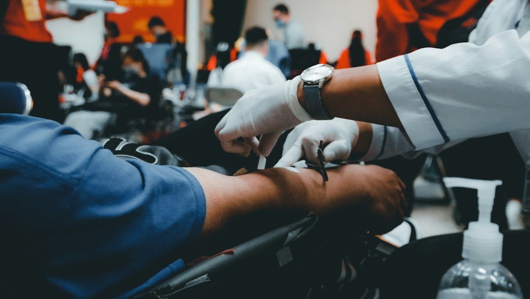 Nurse preparing a donor at the blood donation drive