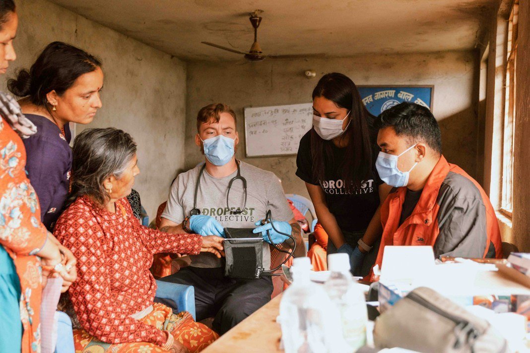 Doctors and volunteers at a community health outreach camp